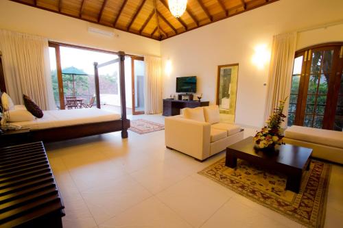 a living room with a couch and a table at Ellen's Place in Colombo