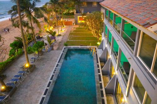 an aerial view of a hotel with a swimming pool and the beach at Earl's Regent Negombo in Negombo