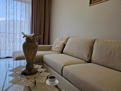 a living room with a couch and a glass table at Alvina Complex Tsaghkadzor in Tsaghkadzor