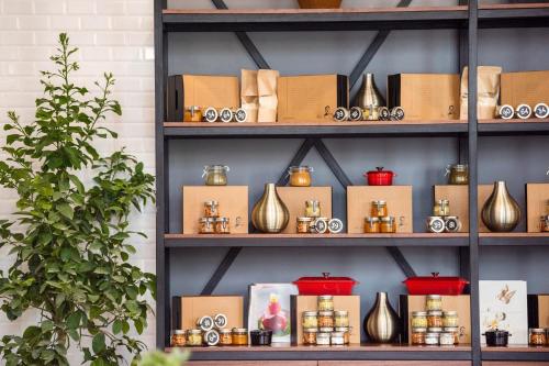a shelf with vases and other items on it at Al Messila, A Luxury Collection Resort & Spa, Doha in Doha