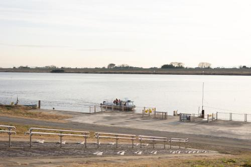 a dock with a boat in the water at TEMPLESTAY ZENSŌ in Chiyodamachi