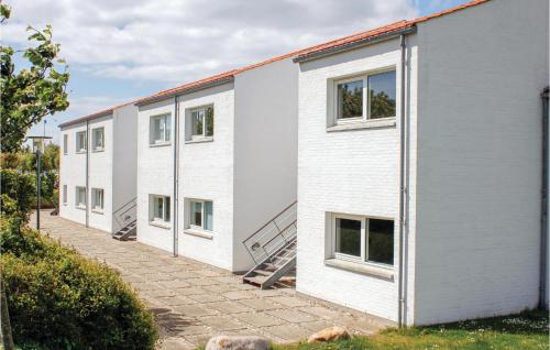 a row of white apartment buildings with windows at 3 Bedroom Cozy Apartment In Ebeltoft in Ebeltoft