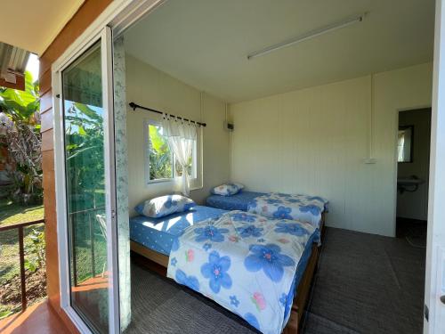 Postel nebo postele na pokoji v ubytování Rak Suan Homestay รักสวนโฮมสเตย์