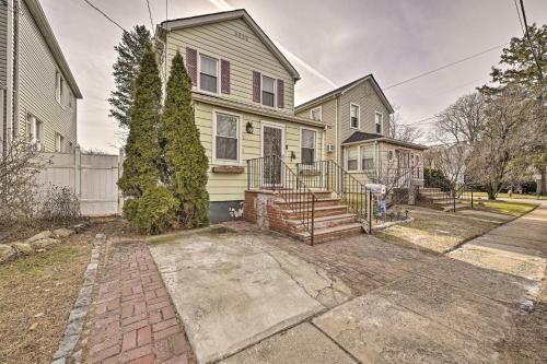 a house with a brick driveway in front of it at Charming New York Escape Near Central Park! in Jericho