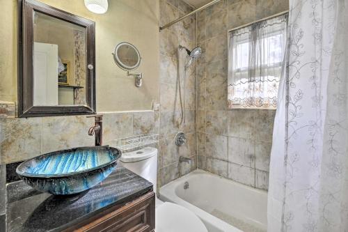 a bathroom with a sink and a bath tub at Charming New York Escape Near Central Park! in Jericho