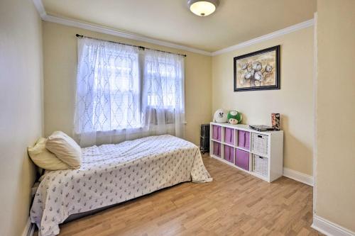a bedroom with a bed and a window at Charming New York Escape Near Central Park! in Jericho