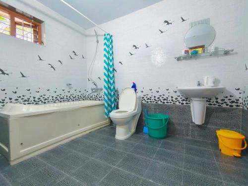 Ένα μπάνιο στο White Sands Homestay