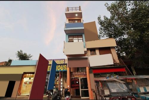 a building with a tower on top of it at Hotel Radhe Inn By WB Inn in Agra