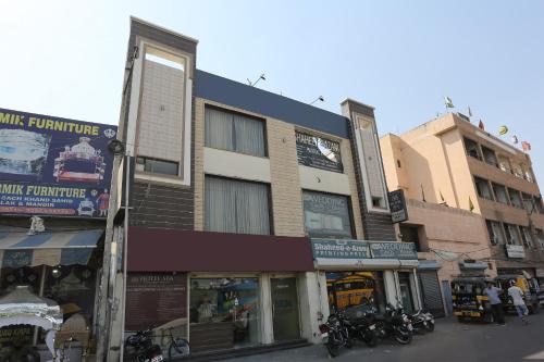 a group of buildings on a city street with motorcycles at Hotel Sea in Patiāla