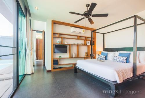 Postel nebo postele na pokoji v ubytování One Bedroom Wings Pool Villa