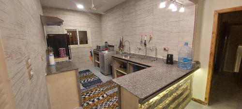 a kitchen with a sink and a counter top at heart of town sea view in Safaga 
