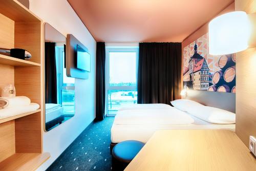 Postel nebo postele na pokoji v ubytování B&B Hotel Bamberg