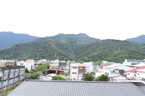 a view of a city with mountains in the background at 關山棧民宿 in Guanshan