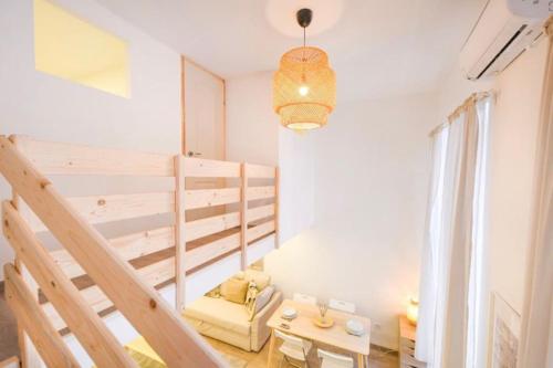 a small room with a bunk bed and a table at 2 bedroom flat in Nyar str., Boutique in Budapest