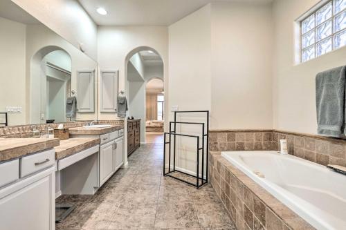 a large bathroom with two sinks and a tub at Phoenix Vacation Rental Near Golf and Shopping in Phoenix