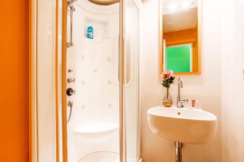 a bathroom with a shower and a sink at Ange Gardien IV AP4326 By Riviera Holiday Homes in Villefranche-sur-Mer