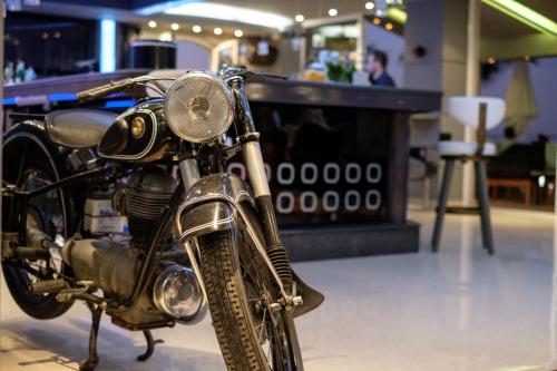 a motorcycle is on display in a show room at Glaros Beach Hotel in Hersonissos