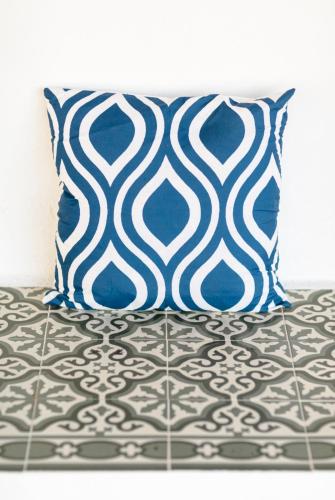 a blue pillow sitting on top of a bed at Finca de l’Anglés. Levante in Potríes