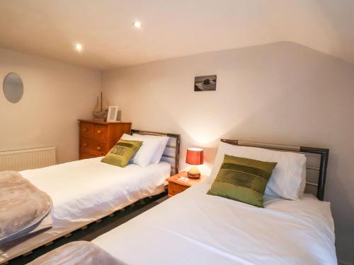 Voodi või voodid majutusasutuse The Old Sweet Shop toas