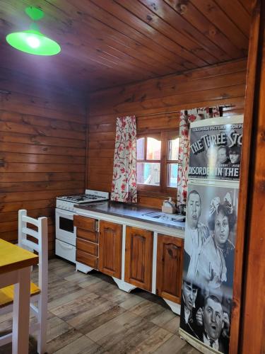 a kitchen with a stove and a stove top oven at Cabaña Los Acacios II y Los Los Acacios Lobos in Lobos