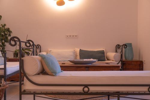 a living room with a couch and a table at Hostal Aigua Clara in Playa Migjorn
