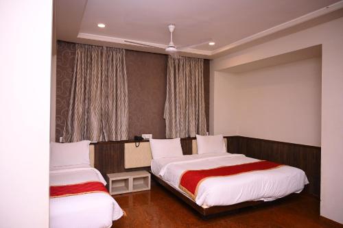 Katil atau katil-katil dalam bilik di HOTEL CENTER POINT