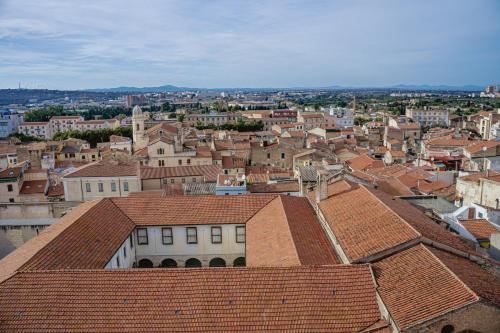 a view of a city with buildings and roofs at S'ARD Guest House Sassari in Sassari