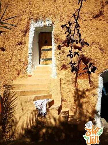 a stairway leading to a door in a building at Touring Club MARHALA MATMATA in Matmata