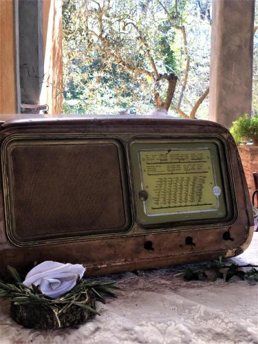 an old tv sitting on the ground in the snow at Casale l'Antica Mola in Castel Madama