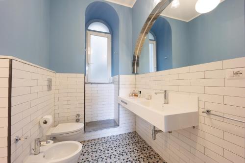 a bathroom with a sink and a toilet at The Bellini House by House In Naples in Naples