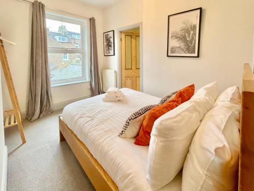 a large bed in a room with a window at Harley's House in York