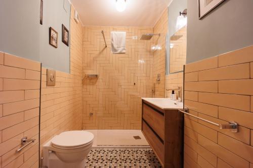 a bathroom with a toilet and a sink at The Bellini House by House In Naples in Naples