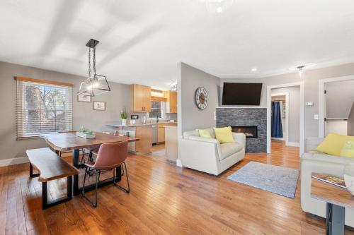 a living room and kitchen with a table and a couch at Lakeshore Living in Lake Junaluska