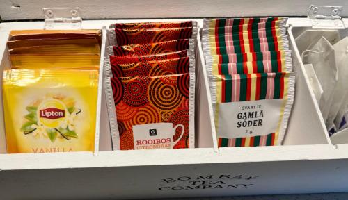 a drawer with ties in a box on a shelf at Lilla huset Bed & Breakfast - countryside guesthouse, free parking in Örebro