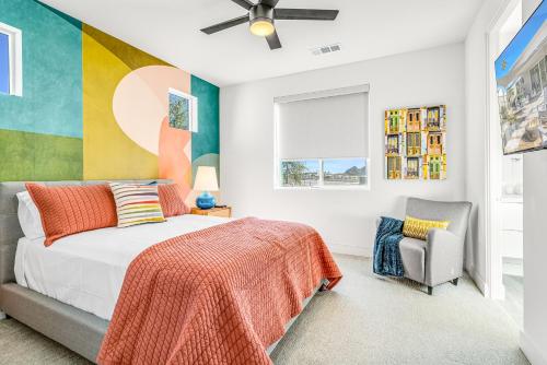 a bedroom with a bed and a chair at Artfully Indian Wells in Indian Wells