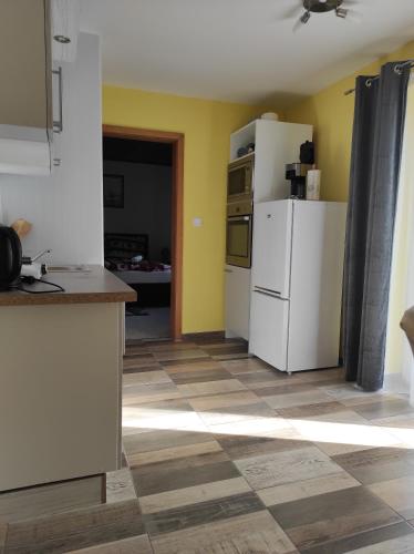 a kitchen with two white refrigerators in a room at Haus Kraus in Bayerisch Eisenstein