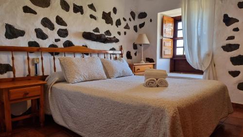 Un pat sau paturi într-o cameră la Sombrero de Pico A