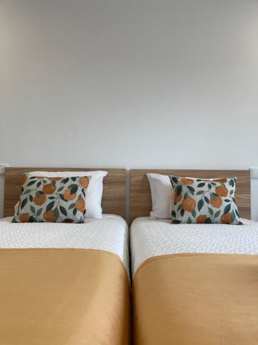 Postel nebo postele na pokoji v ubytování Quintinha Silvestre