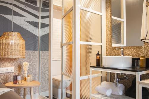 a bathroom with a sink and a shower at room Select Tetuán in Seville