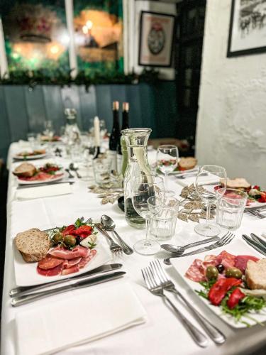a long table with plates of food on it at The Crown Inn in Lanlivery