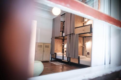 a room with two beds and a large mirror at Villa Viva Cape Town in Cape Town