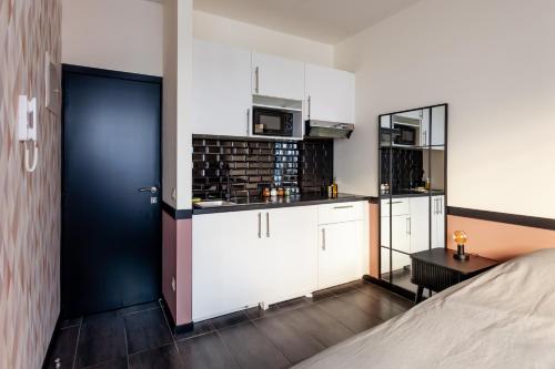 Η κουζίνα ή μικρή κουζίνα στο Hey - Aparthotel Brussels