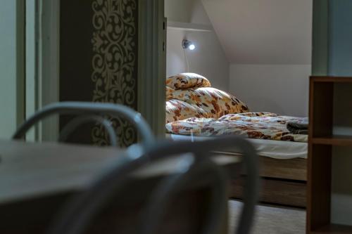 Кровать или кровати в номере Katyca Apartman