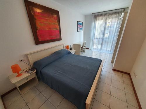 Postel nebo postele na pokoji v ubytování Ferretti Residence Garda Palace