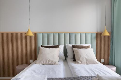 Ένα ή περισσότερα κρεβάτια σε δωμάτιο στο Symphony Modern Tower Apartamenty