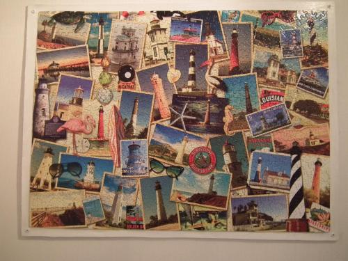 a collage of pictures of cities on a wall at Am Wiesengrund - mit 2 Schlafzimmern in Ribnitz-Damgarten