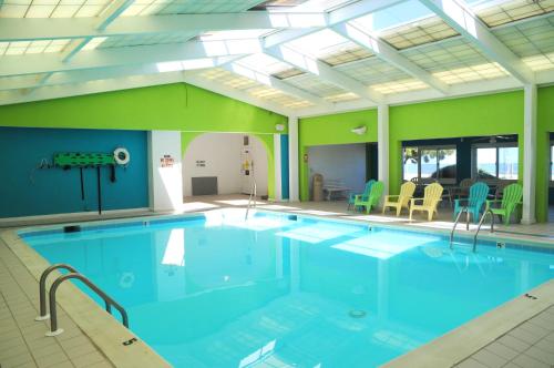a large indoor pool with a ceiling at Dolphin Run in Virginia Beach