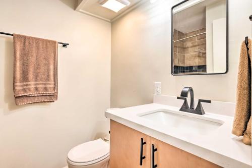 a bathroom with a sink and a toilet at Honolulu Vacation Rental Walk to Beaches in Honolulu