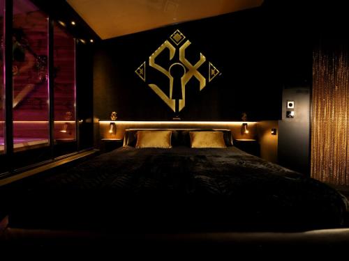 Ένα ή περισσότερα κρεβάτια σε δωμάτιο στο SXCAPE ROOM