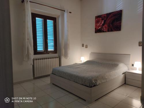 Łóżko lub łóżka w pokoju w obiekcie Appartamento Con terrazza